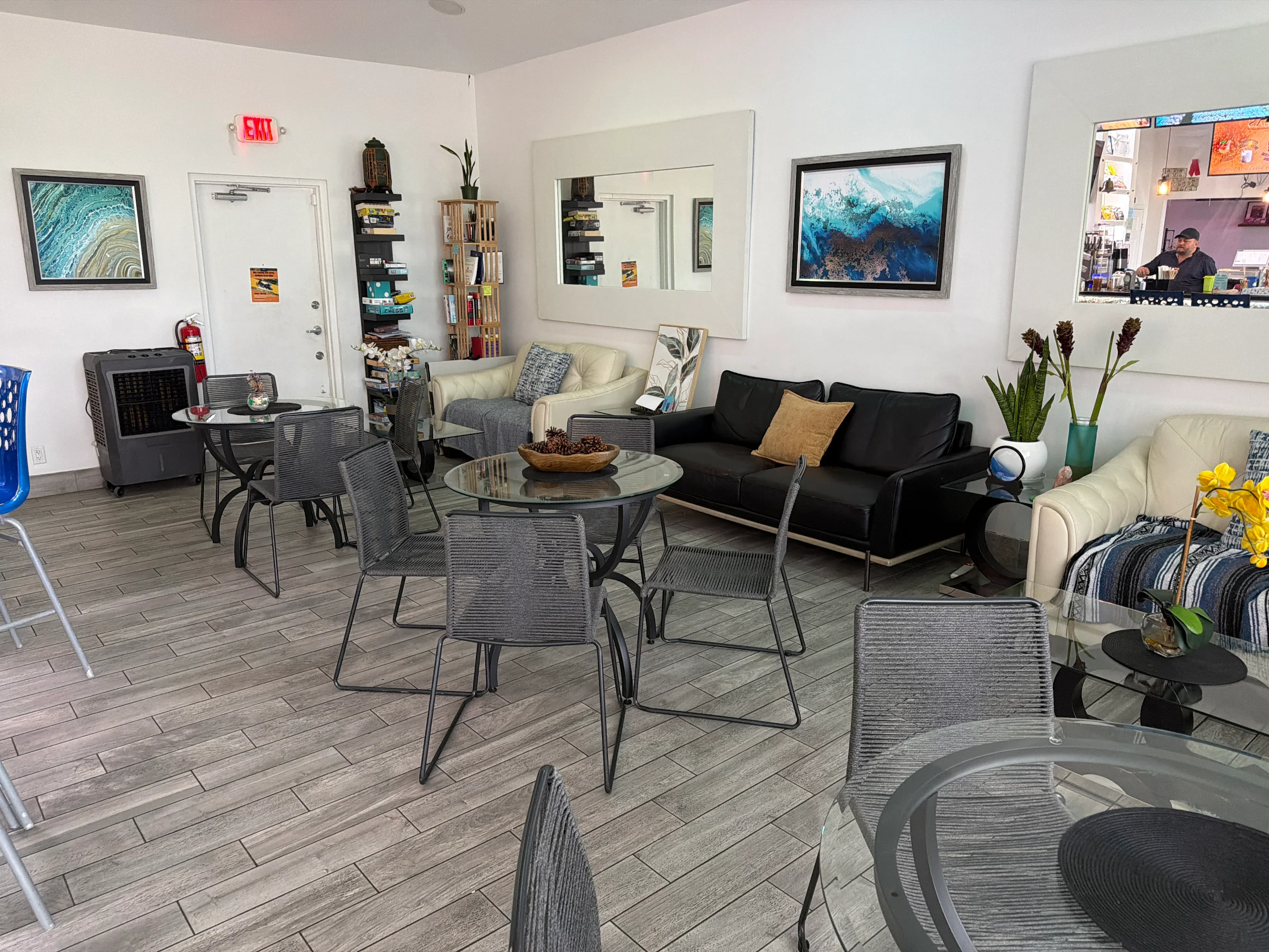 Bright lounge seating and community tables at Zen Clarity