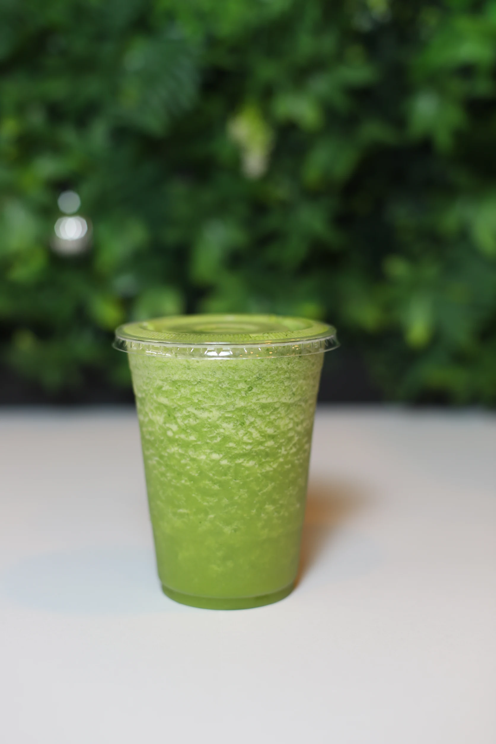 Green smoothie in a to-go cup